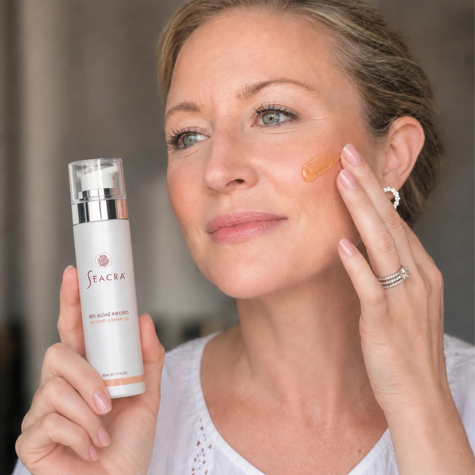 Woman applying Seacra Red Algae Gel to sensitive redness-prone skin